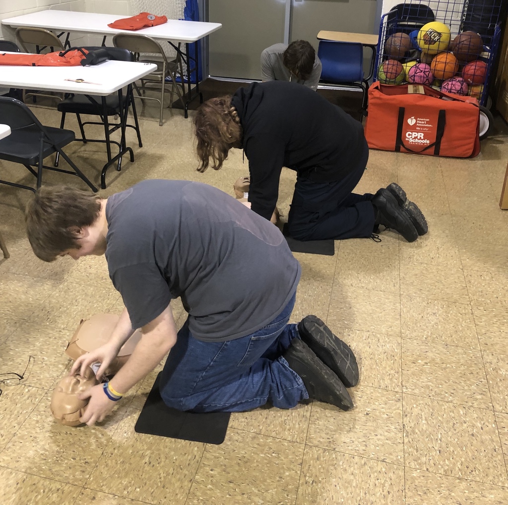 student practicing chest compressions